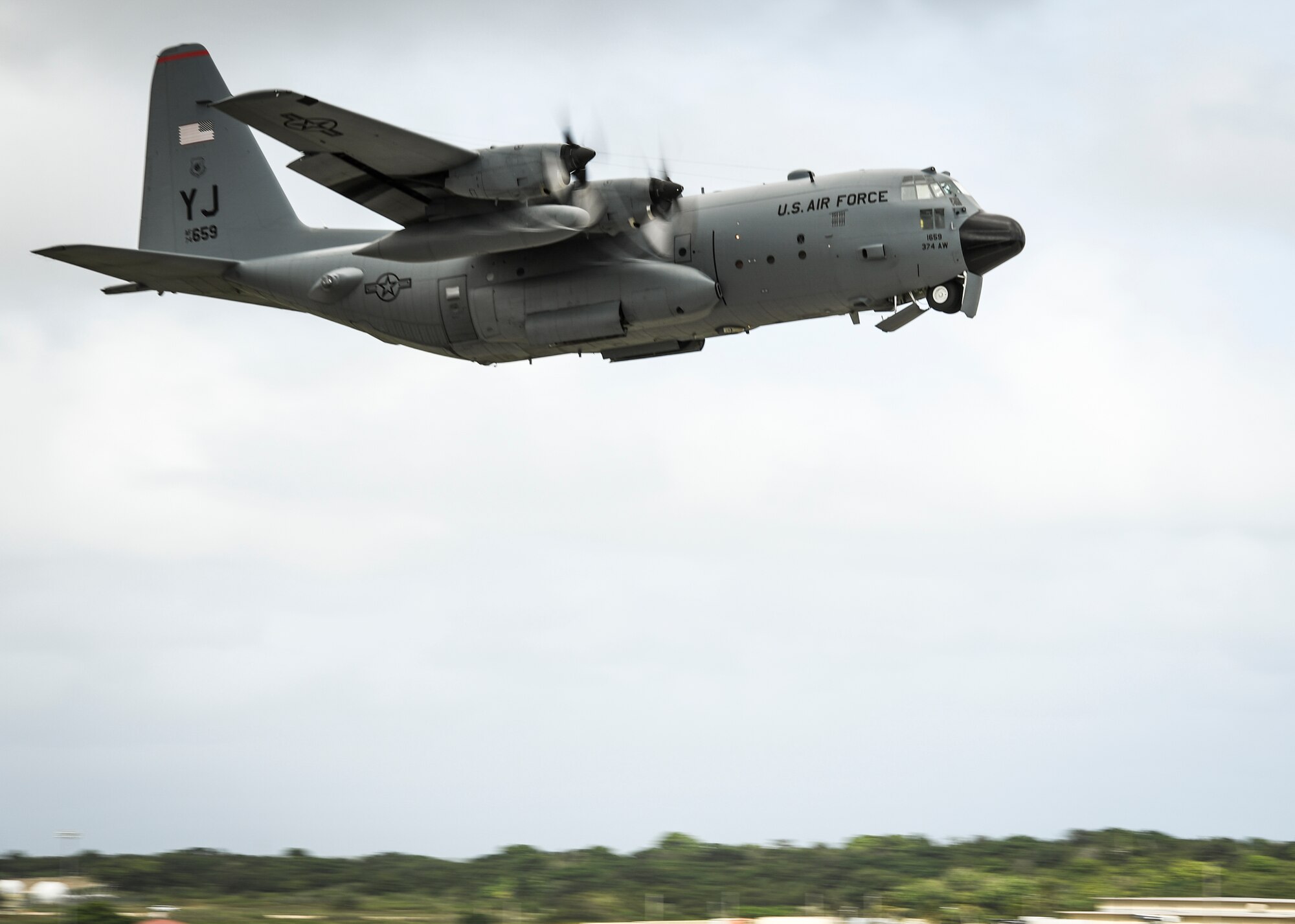 A C-130H Hercules with the 36th Airlift Squadron takes off during Operation Christmas Drop at Andersen Air Force Base, Guam, Dec. 7, 2016. C-130s are ideal for performing air drops like those conducted during OCD because they are large enough to carry cargo and small enough to maneuver at relatively low altitudes. (U.S. Air Force photo by Senior Airman Elizabeth Baker/Released)