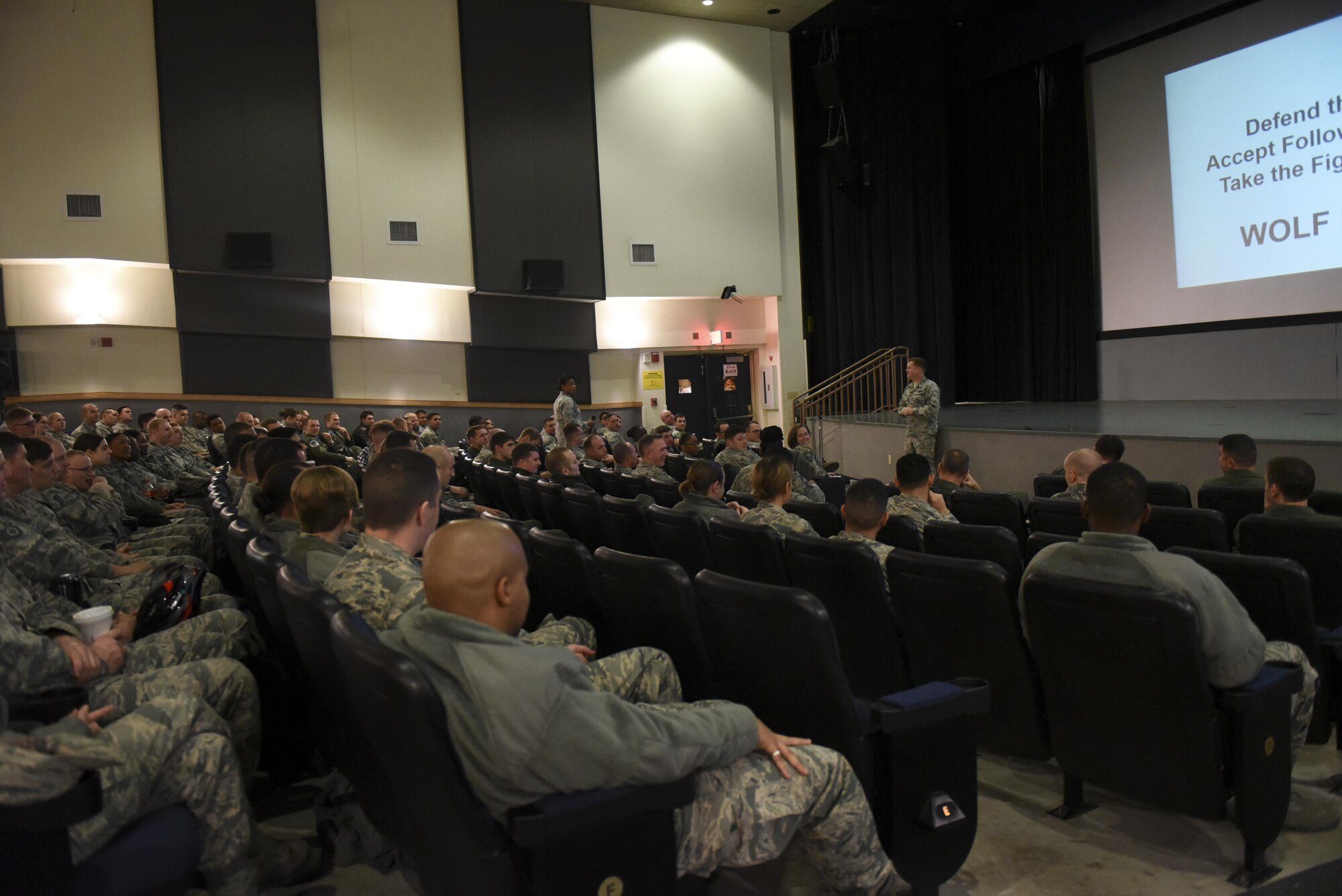 Col. Todd Dozier, 8th Fighter Wing commander, speaks with airmen during an all call at Kunsan Air Base, Republic of Korea, Dec. 9, 2016. Dozier hosted the all call to congratulate airmen on their performance throughout the year and concluded the brief with a question and answer session. (U.S. Air Force photo by Senior Airman Michael Hunsaker/Released)