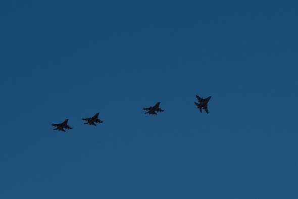 F-16 Fighting Falcons assigned to the 134th Expeditionary Fighter Squadron arrive in a four-ship formation at the 407th Air Expeditionary Group, Southwest Asia, Dec. 10, 2016. The F-16 squadron is comprised of Airmen from the 158th Fighter Wing of the Vermont Air National Guard. (U.S. Air Force photo by Master Sgt. Benjamin Wilson)