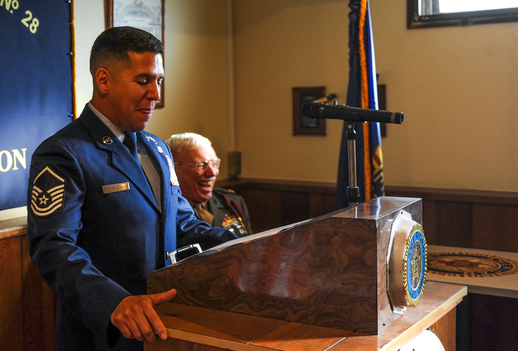 U.S. Air Force Master Sgt. Thundercloud Hirajeta delivers a speech during his reenlistment ceremony, Dec. 2, 2016, at the American Legion Wayne E. Marchand post on Okinawa, Japan. After years of service, Hirajeta was reenlisted by retired United States Marine Corps Maj. John Glenn. (U.S. Air Force photo by Airman 1st Class Nick Emerick/Released) 