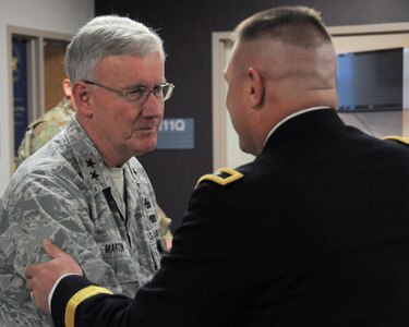 Maj. Gen. Troy D. Kok, commanding general of the Army Reserve’s 99th Regional Support Command, meets with Maj. Gen. Thaddeus J. Martin, adjutant general for the Connecticut National Guard, during a capabilities briefing for federal congressional staff members Dec. 9 at the Maj. Gen. Maurice Rose Armed Forces Reserve Center in Middletown, Connecticut. Kok hosted the event in order to help the congressional members understand the Army Reserve’s unique roles and capabilities, to include support to civil authorities in response to natural disasters.