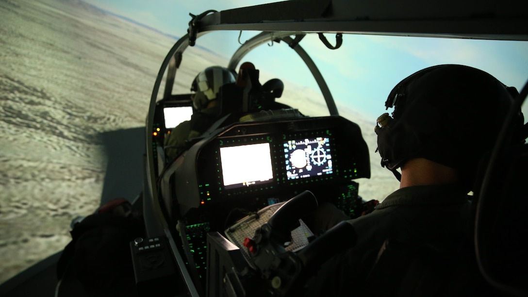 Two Marine AH-1Z Viper pilots with Marine Light Attack Helicopter Squadron (HMLA) 169 prepare for exercise Seahorse Wind in a Viper simulator at Marine Corps Air Station Camp Pendleton, Calif., Dec. 1. Exercise Seahorse Wind was a long-range raid exercise conducted by over 600 Marines with the 3rd Marine Aircraft Wing and the 1st Marine Division. 