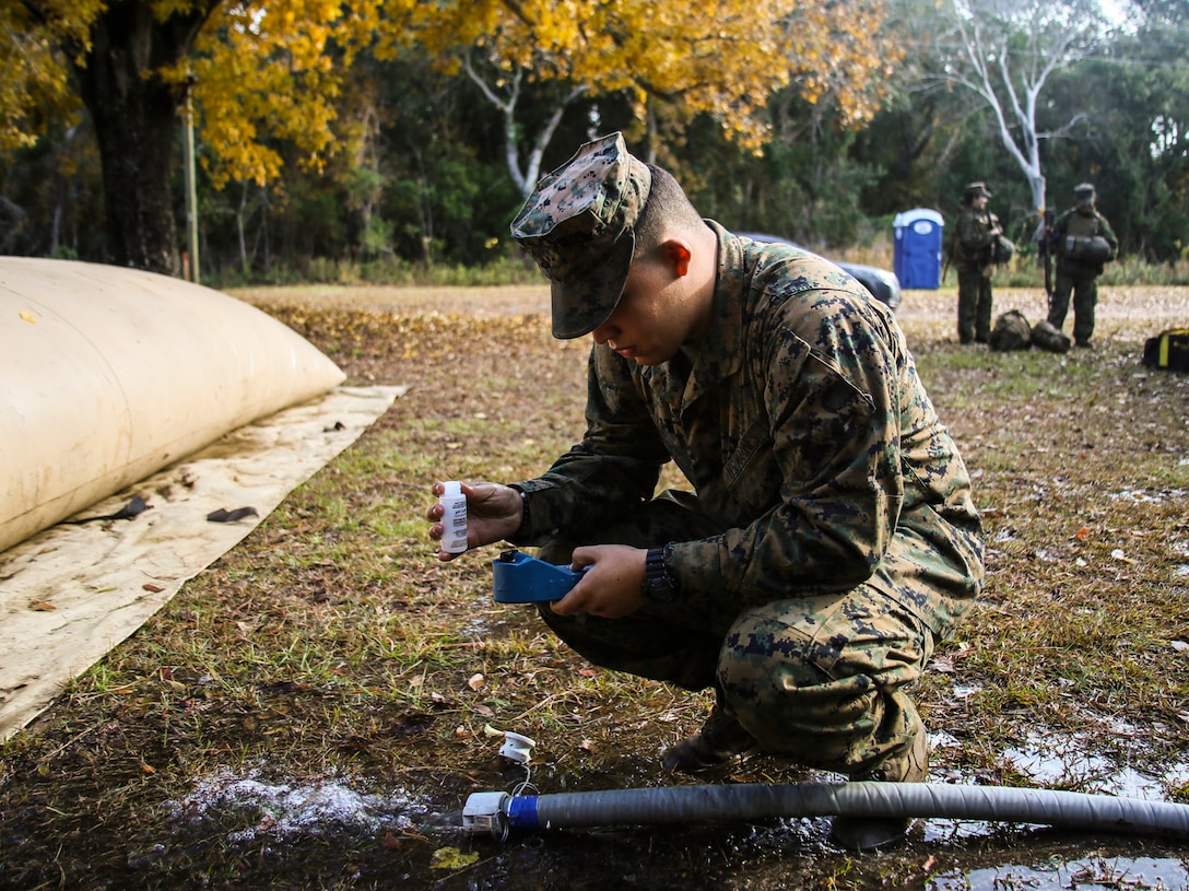 Pfc. Andrew Weaver checks the PH level of water being purified for use by the Marines of Marine Wing Support Squadron 271, Marine Aircraft Group 14, 2nd Marine Aircraft Wing, during a two-week field exercise aboard Marine Corps Auxiliary Landing Field Bogue, N.C., Nov. 30, 2016. During the two weeks, water support technicians provided enough water to the squadron’s encampment for the Marines to have clean drinking water, shower facilities, laundry facilities, and cooking water. Weaver is a water support technician with MWSS-271. (U.S. Marine Corps photo by Sgt. Austin Long/ Released) 