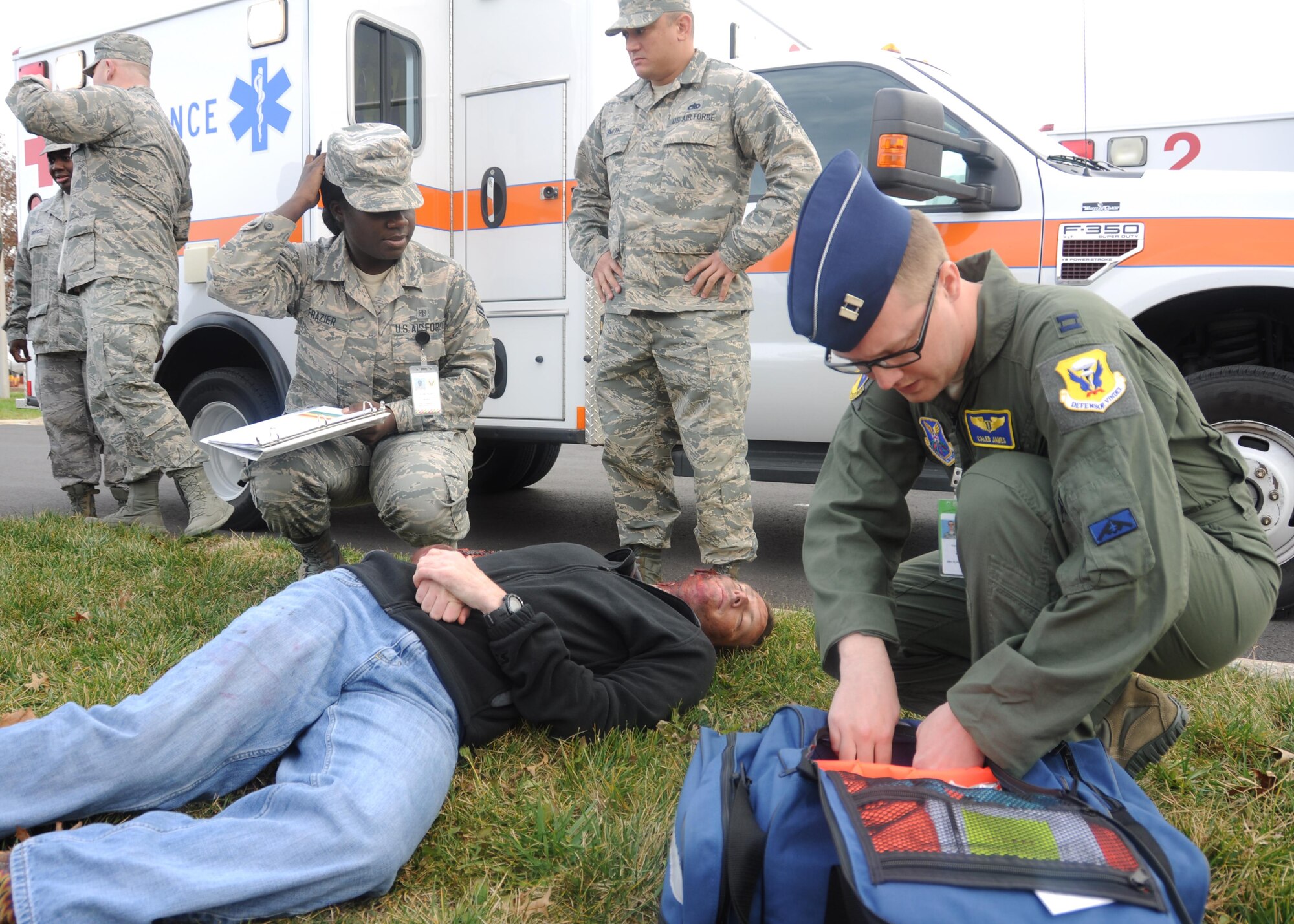Medical personnel respond to a simulated mass casualty scenario during a total force exercise at Whiteman Air Force Base, Mo., Dec. 3, 2016. Volunteers were given different roles to simulate the varying degree of victims' temperaments and injuries. (U.S. Air Force photo/Senior Airman Missy Sterling)