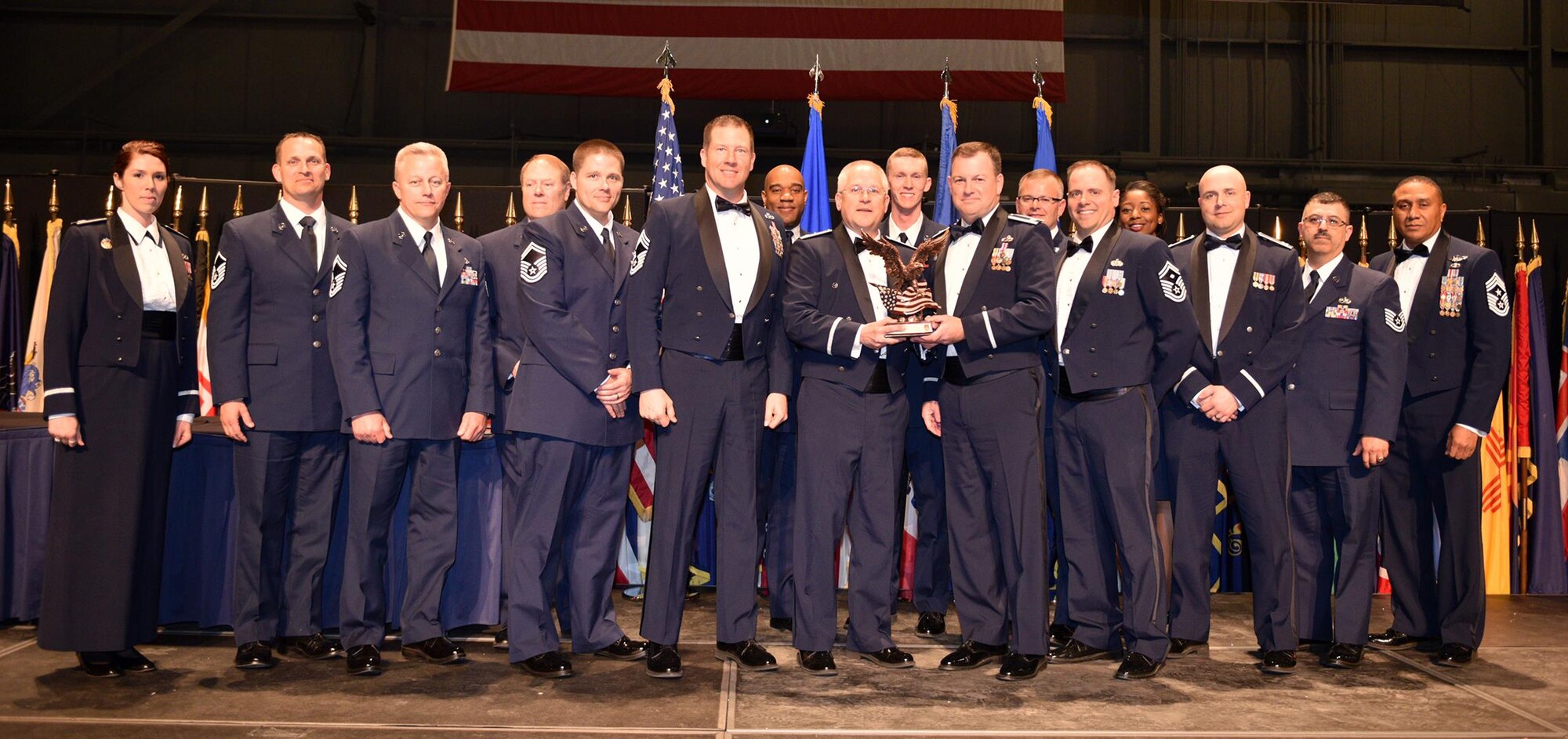 The 445th Maintenance Squadron accepts the 2015 445th AW Squadron of the Year from Col. Jeffrey McGalliard, 445 AW commander, during the wing’s annual awards banquet April 2, 2016. More than 520 Airmen, family members and community leaders celebrated a night of achievements and accomplishments. (U.S. Air Force photo /Tech. Sgt. Frank Oliver)
