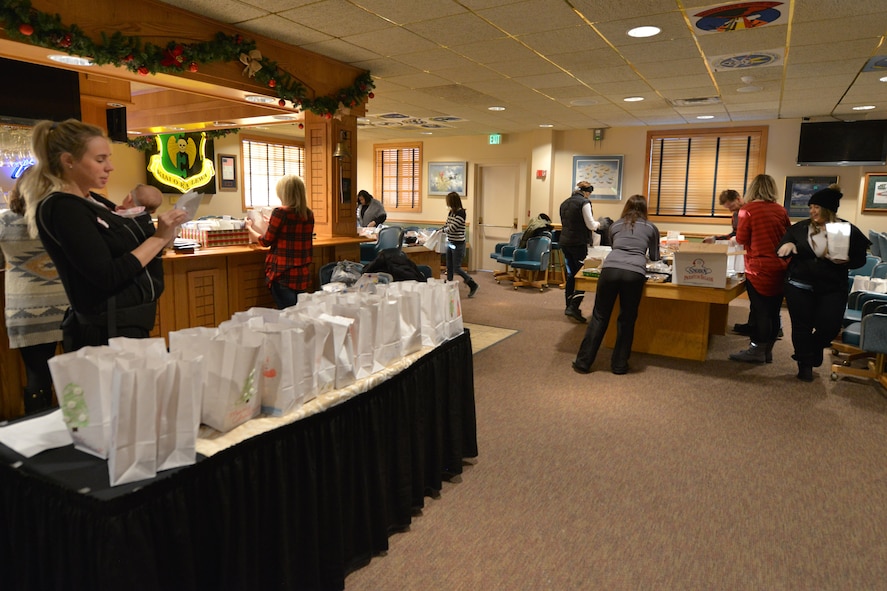 Volunteers from the Officer’s Spouses Club organize cookies at the annual Airman’s Cookie Drive at Minot Air Force Base, N.D., Dec. 9, 2016. The cookies were placed in bags decorated by elementary students on base and delivered by base first sergeants to Team Minot Airmen.  (U.S. Air Force photo/Airman 1st Class Jessica Weissman)