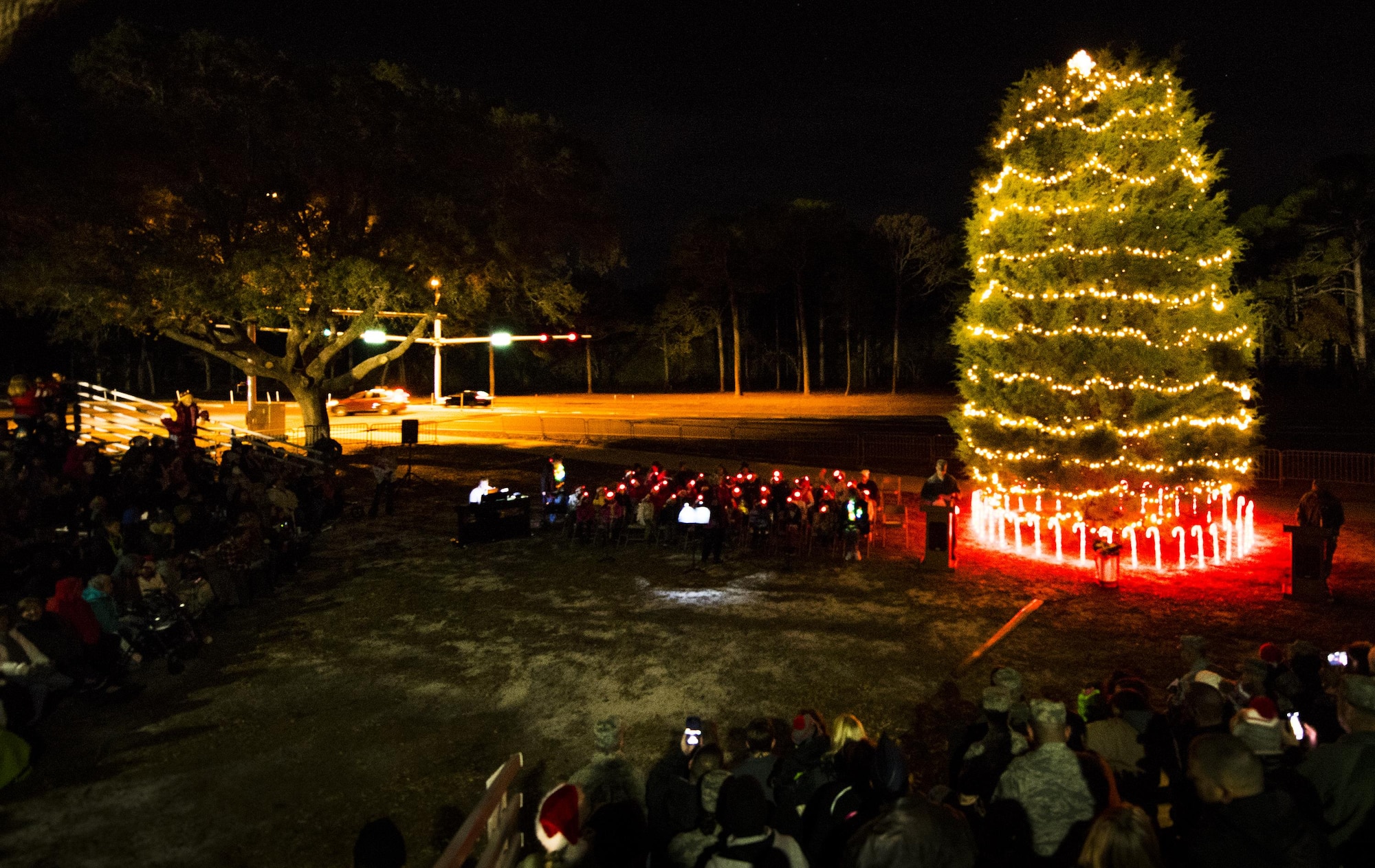 The base’s Christmas tree was lit up in a small, chilly ceremony Dec. 9 at Eglin Air Force Base, Fla.  The event was followed by a visit from Santa and refreshments at the base chapel.  During the event, the winners of the base’s annual Christmas card competition were announced.  The 96th Civil Engineer Group won this year’s prize.  (U.S. Air Force photo/Samuel King Jr.)