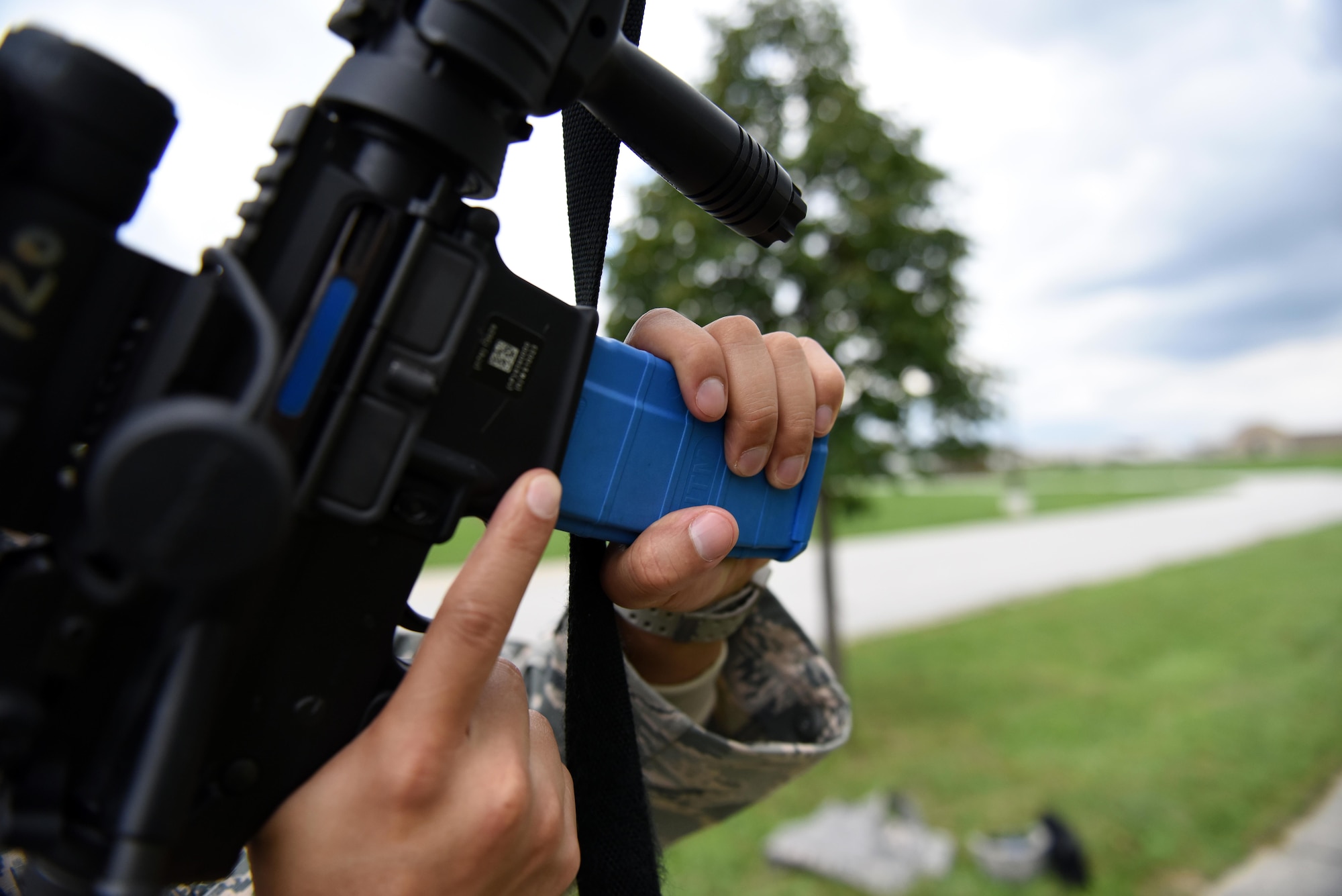 An Airman with Security Forces Squadron at the 180th Fighter Wing in Swanton, Ohio loads his M4 Carbine with training ammunition before conducting urban combat training Oct. 1, 2016, at the Maumee Police and Fire Training Center in Maumee, Ohio. Training exercises improve communications skills, small unit and squad tactics and close quarter combat skills for Security Forces personnel.