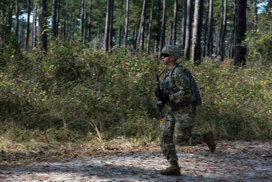 Airman 1st Class Tyris Smith, 824th Base Defense Squadron fire team member, runs to back up his counterparts during dismount training, Dec. 8, 2016, at Moody Air Force Base, Ga. Each member of the 824th BDS, also known as the Ghostwalkers, has the responsibility of being alert and providing security for others on the team. (U.S. Air Force photo by Airman 1st Class Greg Nash)