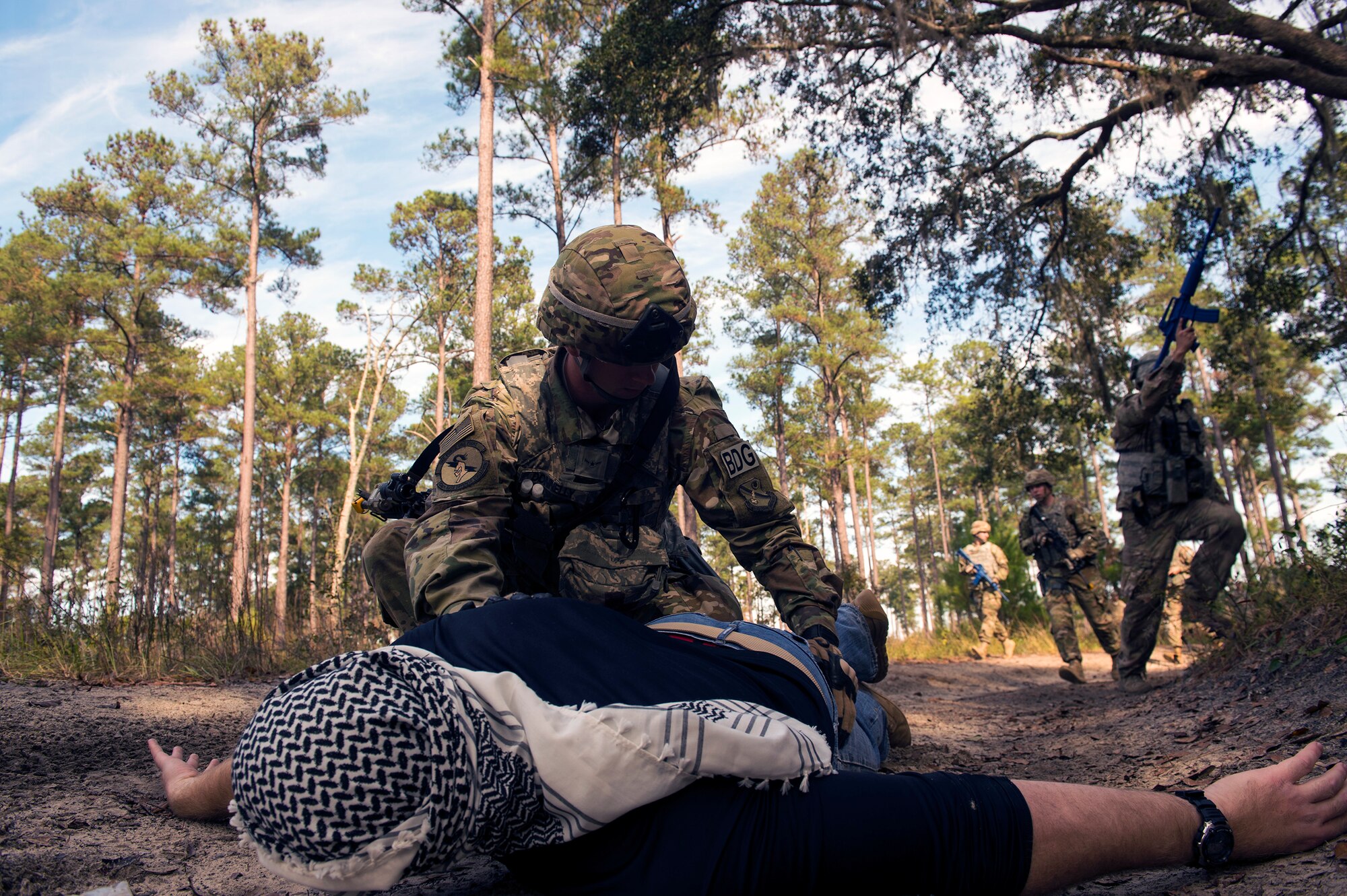 Airman Cole Donnelly, 824th Base Defense Squadron fire team member, interrogates and searches a mock insurgent during dismount training, Dec, 8, 2016, at Moody Air Force Base, Ga. The training replicated scenarios and an environment that the 824th BDS may encounter downrange. (U.S. Air Force photo by Airman 1st Class Greg Nash)