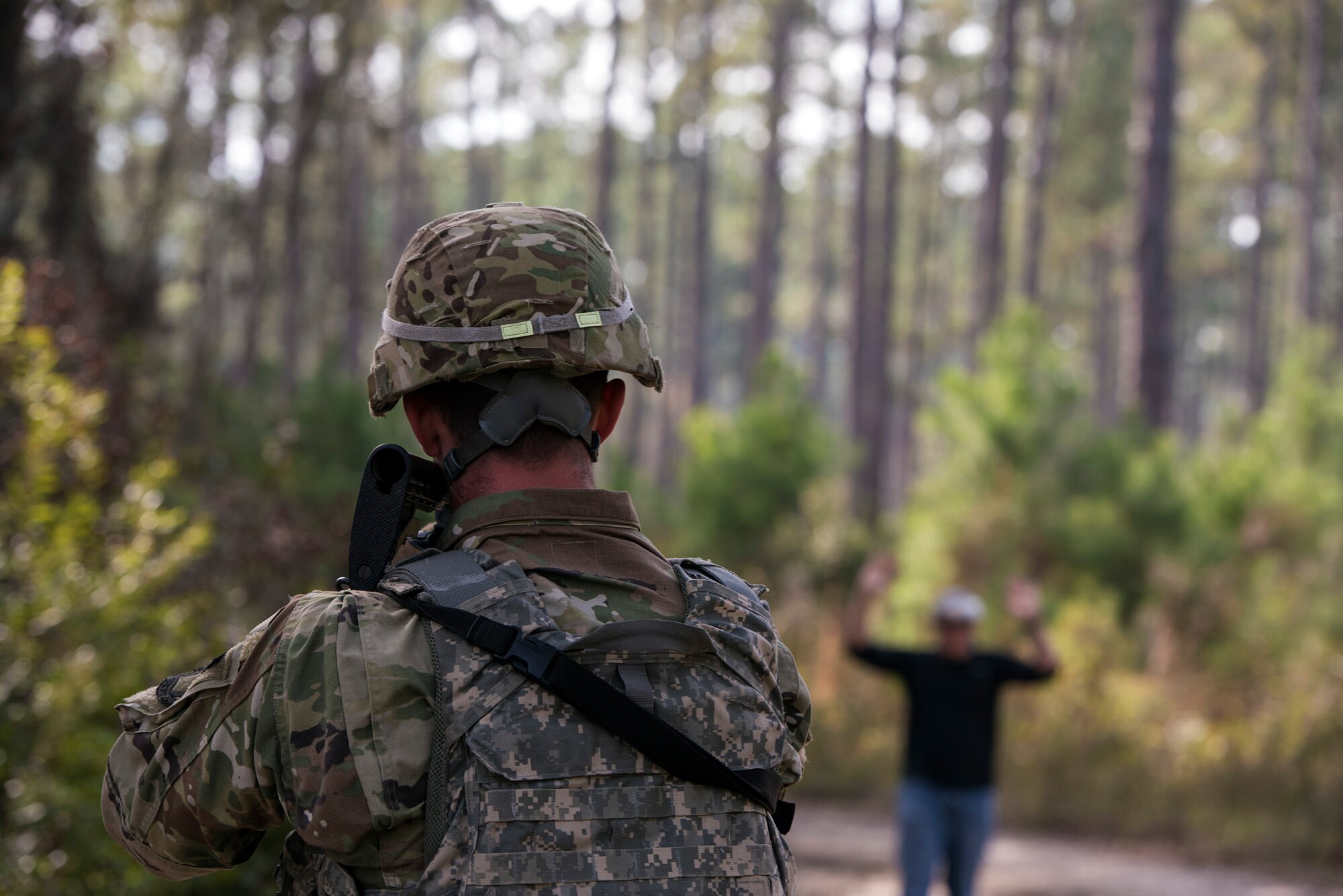 Airman Cole Donnelly, 824th Base Defense Squadron fire team member, confronts a mock insurgent during dismount training, Dec. 8, 2016, at Moody Air Force Base, Ga. The 824th BDS maintains combat and specialty training standards to ensure readiness at all times. (U.S. Air Force photo by Airman 1st Class Greg Nash)