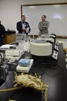 Air Force Sustainment Center Commander Lt. Gen. Lee K. Levy II, right, talks with Oklahoma School of Science and Mathematics President Dr. Frank Y.H. Wang in a science laboratory inside the Dr. Edna McDuffie Manning Academic Center Dec. 1. In the foreground is the head of a massive sunflower seed used for instruction in the natural sciences lab. General Levy learned about the school’s programs while personally engaging the students to foster better understanding of the opportunities for STEM careers in AFSC and the Air Force. (U.S. Air Force photo/Greg L. Davis)