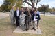 Air Force Sustainment Center Commander Lt. Gen. Lee K. Levy II, seated left, is joined by Oklahoma School of Science and Mathematics President Dr. Frank Y.H. Wang, seated right, as they pose with a statue of Dr. Albert Einstein toward the end of a visit by AFSC senior leaders Dec. 1. Shown standing are, from left, Col. Charles Gaona, AFSC Engineering deputy director; Kevin Stamey, AFSC Engineering director; and OSSM students Jimmy Ma, Sahar Hasan, Aaron Park and Lawton Blanchard. (U.S. Air Force photo/Greg L. Davis)