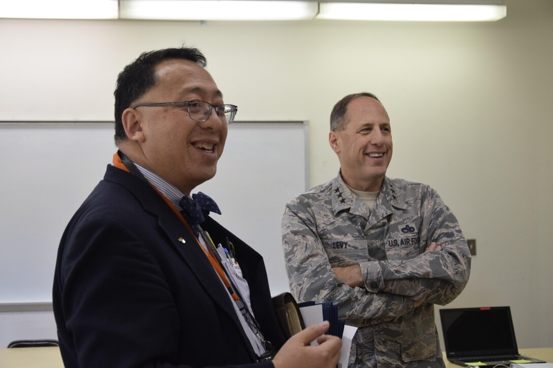 Oklahoma School of Science and Mathematics President Dr. Frank Y.H. Wang, left, discusses amenities of a science laboratory inside the Dr. Edna McDuffie Manning Academic Center with Air Force Sustainment Center Commander Lt. Gen. Lee K. Levy II during a tour of the school Dec. 1. General Levy learned about the school’s programs while personally engaging the students to foster better understanding of the opportunities for STEM careers in AFSC and the Air Force. (U.S. Air Force photo/Greg L. Davis)