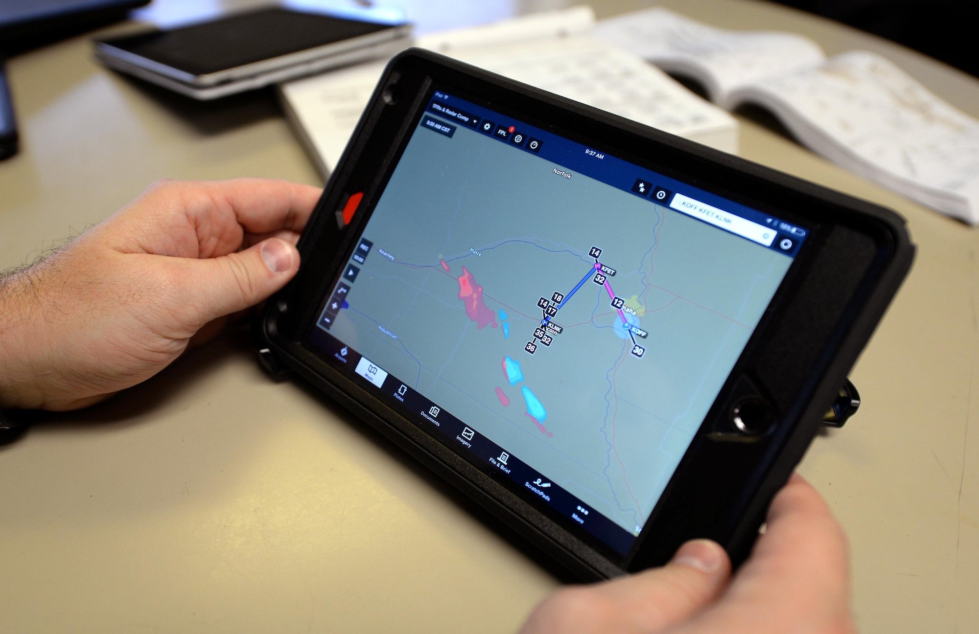 An Offutt pilot uses an electronic flight bag while mission planning Dec. 12, 2016 at Offutt Air Force Base, Neb. The EFBs, which utilize Apple iPad technology, will replace paper publications and manuals going forward. (U.S. Air Force photo by Delanie Stafford)