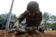 U.S. Air Force Senior Airman Victor Martinez, 20th Civil Engineer Squadron explosive ordnance disposal (EOD) journeyman, conducts reconnaissance on simulated unexploded explosive ordnance at Shaw Air Force Base, S.C., Dec. 12, 2016. EOD Airmen perform similar drills four times a week to ensure they are mission-ready and capable. (U.S. Air Force photo by Airman 1st Class Kelsey Tucker)
