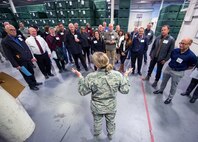 Honorary commanders from Travis Air Force Base, Calif., get a briefing during their tour of the 60th Mission Support Group, Dec. 2, 2016. The purpose of the Travis Honorary Commander Program is to promote relationships between base senior leadership and civilian partners, foster civic appreciation of the Air Force mission and its Airmen, maximize opportunities to share the Air Force story with new stewards, and communicate mutual interest, challenges, and concerns that senior leaders and civilian stakeholders have in common. (U.S. Air Force photo/Louis Briscese)