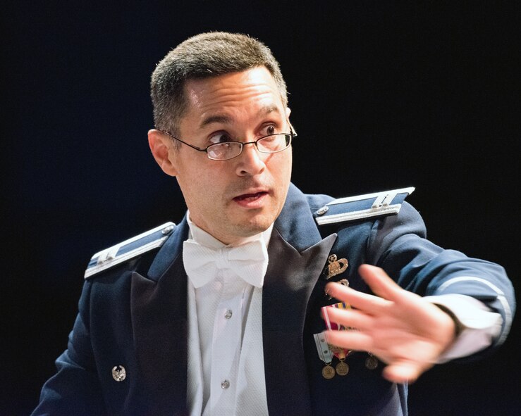 U.S. Air Force Capt. Rafael Toro-Quinones, U.S. Air Force Band of the Golden West commander, conducts the band during a performance at the Veteran’s Home in Yountville, Calif., Dec. 5, 2016. The performance was part of the band’s annual holiday concert series. This year the band performed six shows in six days at five venues entertaining more than 10,000 people. (U.S. Air Force photo/Louis Briscese)