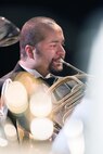 Wayne Vanlui, a French horn player with the U.S. Air Force Band of the Golden West from Travis Air Force Base, Calif., performs during a concert at the Veteran’s Home in Yountville, Calif., Dec. 5, 2016. The performance was part of the band’s annual holiday concert series. This year the band performed six shows over six days at five venues entertaining more than 10,000 people. (U.S. Air Force photo/Louis Briscese)