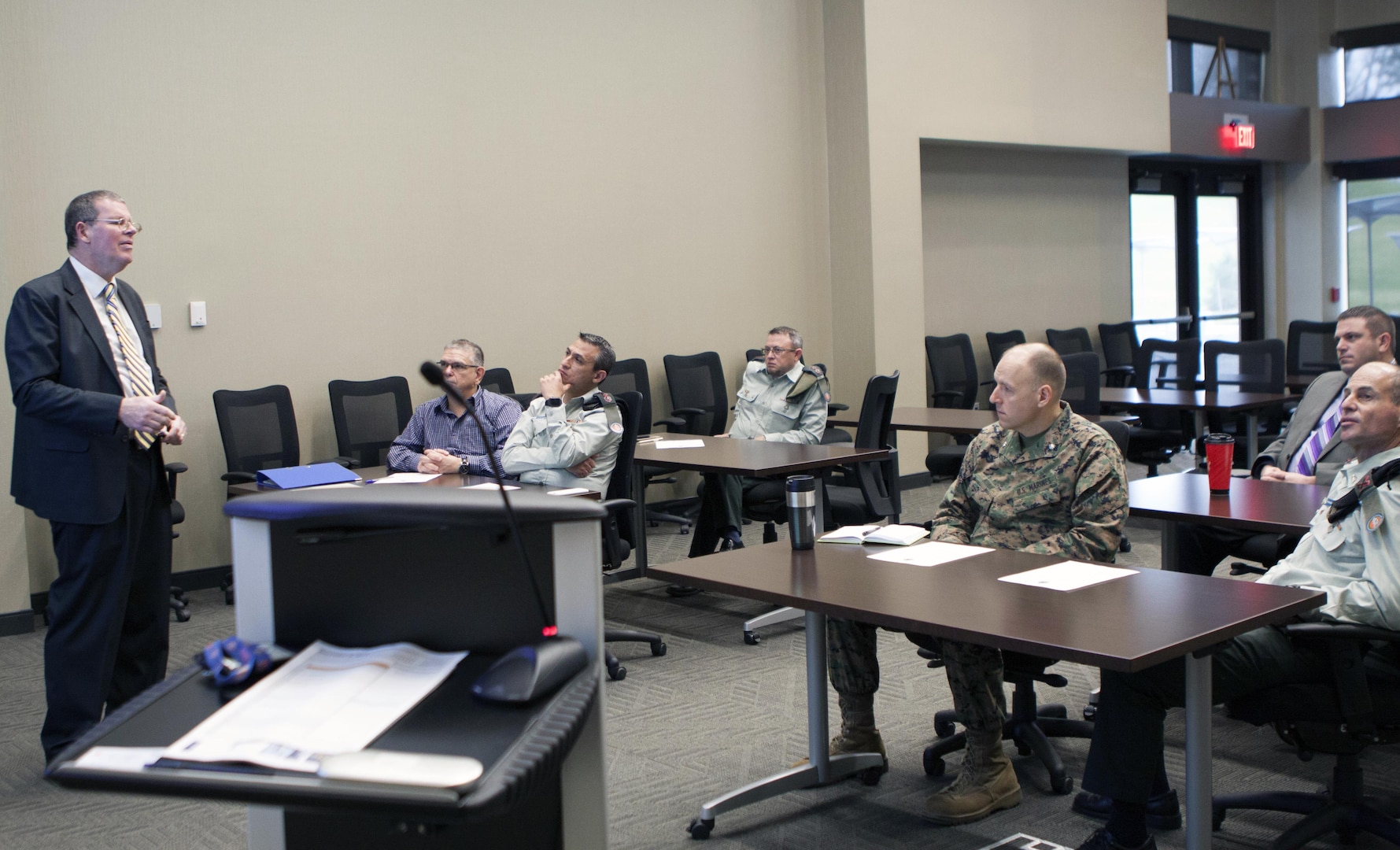 Scott Rosbaugh, director of DLA Distribution’s Strategic Plans directorate, discusses DLA Distribution’s core capabilities with members of the Israel Defense Forces on December 6.