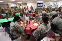 Army Reserve Soldiers assigned to the 85th Support Command come together for a holiday luncheon at the command headquarters during their December battle assembly, Dec. 4, 2016.
(Photo by Sgt. Aaron Berogan)