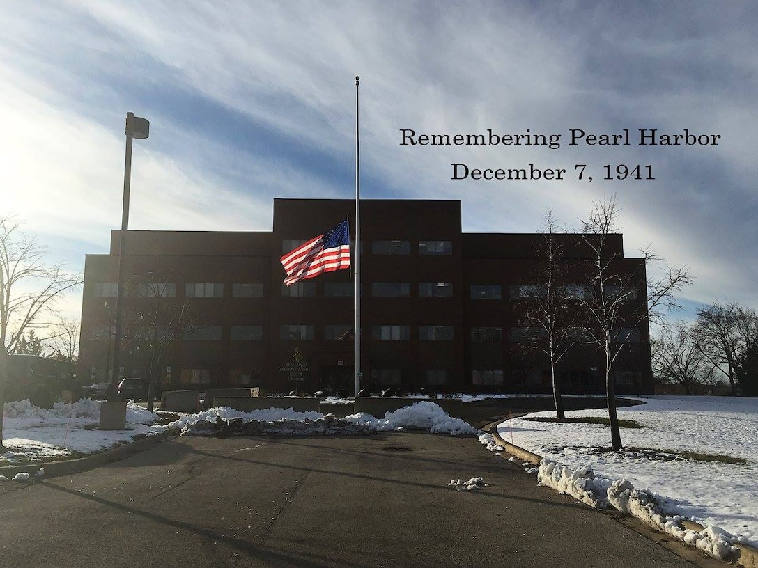 A U.S. flag is flown in front of the 85th Support Command headquarters in remembrance of the individuals who died as a result of their service at Pearl Harbor on December 7, 1941, Dec. 7, 2016. The flag was flown at the direction of the President of the United States for the U.S. flag to be flown at half-staff on all Department of Defense buildings, grounds and naval vessels throughout the U.S. and abroad.
(Photo illustration by Anthony L. Taylor)