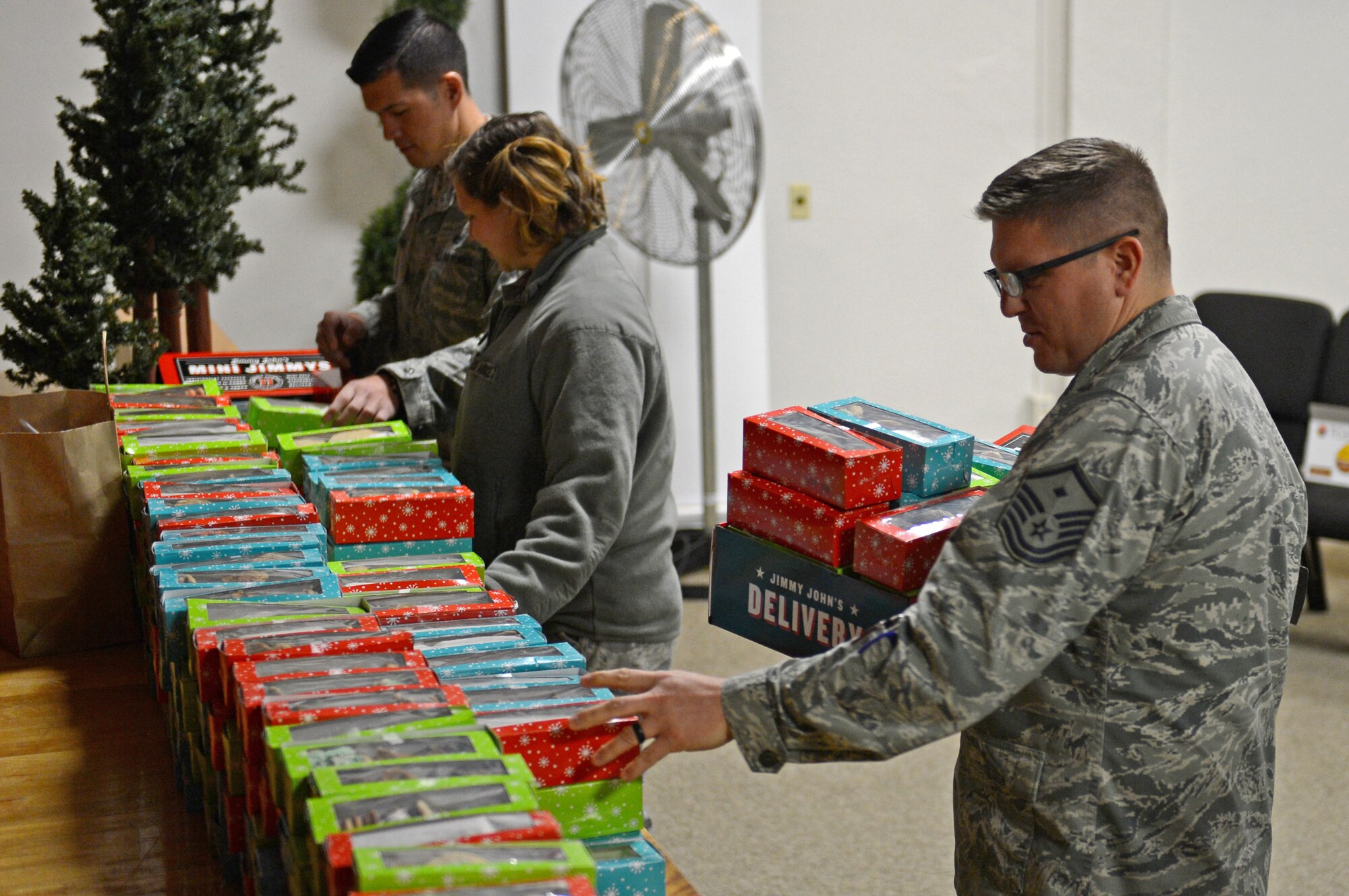 Master Sgt. Matthew Shaver, 627th Civil Engineer Squadron first sergeant, prepares to deliver cookies during Operation Cookie Drop Dec. 9, 2016 at McChord Field, Wash. Shaver along with other McChord First Sergeants delivered more the 500 boxes of cookies to Airmen in the dorms in effort to spread holiday cheer. (U.S. Air Force photo/Senior Airman Divine Cox)