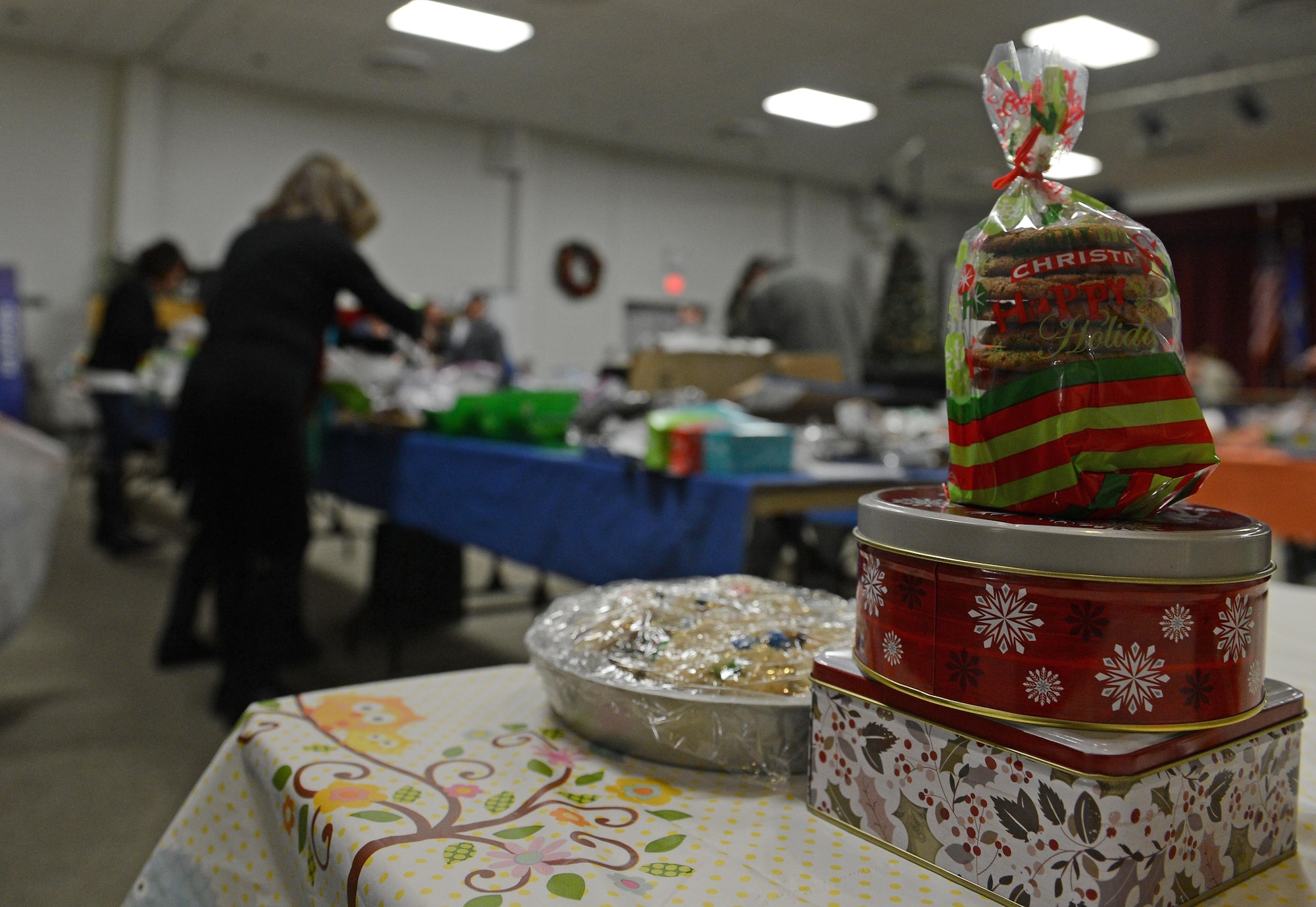 Team McChord volunteers fill boxes with cookies during Operation Cookie Drop Dec. 8, 2016 at McChord Field, Wash. The volunteers assisted with collecting and boxing cookies that were later delivered to Airmen living in the dorms. (U.S. Air Force photo/Senior Airman Divine Cox)