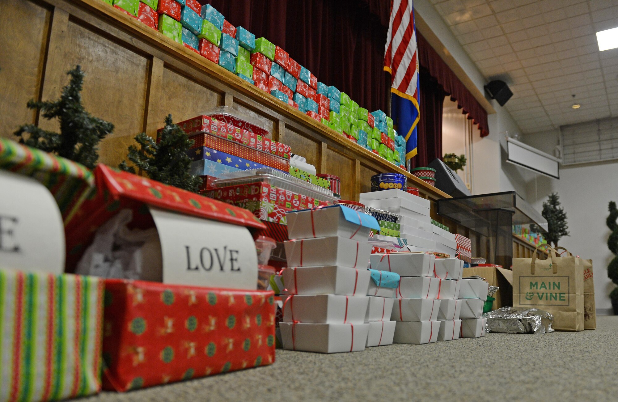 Boxes of cookies are filled and placed on stage at McChord Field Chapel Support Center before being delivered to Airmen Dec. 8, 2016 on McChord Field, Wash. Homemade cookies of all types and sizes were boxed Dec. 8 by volunteers and delivered to Airmen Dec. 9. (U.S. Air Force photo/Senior Airman Divine Cox)