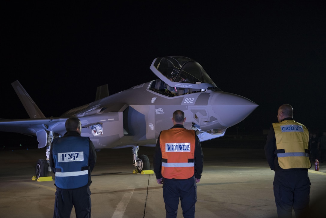Personnel at Nevatim Air Base, Israel, stand by an F-35A Lightning II fighter jet on the flightline, Dec. 12, 2016. Two F-35As arrived in Israel from the United States.
