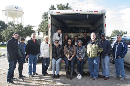 Members of the 338th Specialized Contracting Squadron and the Air Force Installation Contracting Agency San Antonio Directorate stand with a packed U-Haul of gifts they collected for the Salvation Army’s annual Angel Tree charity at Joint Base San Antonio-Randolph Dec. 9, 2016. This is the first year the two organizations have participated in the holiday charity event, which provides gifts for less fortunate children, and all 80 of its Angels were adopted and provided gifts. (U.S. Air Force photo by Airman 1st Class Lauren Parsons/Released)