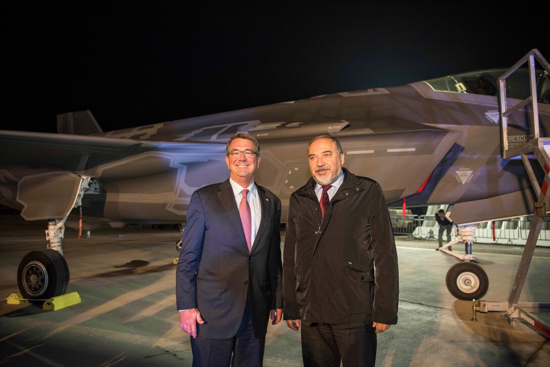 Defense Secretary Ash Carter and Israeli Defense Minister Avigdor Lieberman stand by one of Israel's first two F-35 Lightning II jets during a ceremony at Nevatim Air Base, Israel, Dec. 12, 2016. DoD photo by Air Force Tech. Sgt. Brigitte N. Brantley