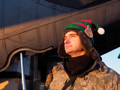 Tech. Sgt. Derek Hansen, 144th Airlift Squadron, works as part of a team of Alaska National Guardsmen to offload gifts, food and school supplies from a 144th AS C-130 Hercules, Dec. 3, 2016, in Akiachak, Alaska. The gifts were distributed to Akiachak residents as part of Operation Santa Claus. (U.S. Army National Guard photo by Sgt. David Bedard)