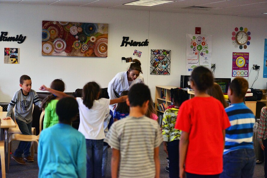 SCHRIEVER AIR FORCE BASE, Colo.--Irene Okuyama Andreassen, United States Karate Academy, leads a karate lesson for Schriever School Age Care program youth at Schriever Air Force Base, Colorado, Friday, Dec. 9, 2016. The lesson provided physical and cognitive development skills. (U.S. Air Force photo/Brian Hagberg)