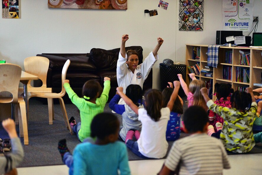 SCHRIEVER AIR FORCE BASE, Colo.--Irene Okuyama Andreassen, United States Karate Academy, leads a karate lesson for Schriever School Age Care program youth at Schriever Air Force Base, Colorado, Friday, Dec. 9, 2016. The lesson provided physical and cognitive development skills. (U.S. Air Force photo/Brian Hagberg)