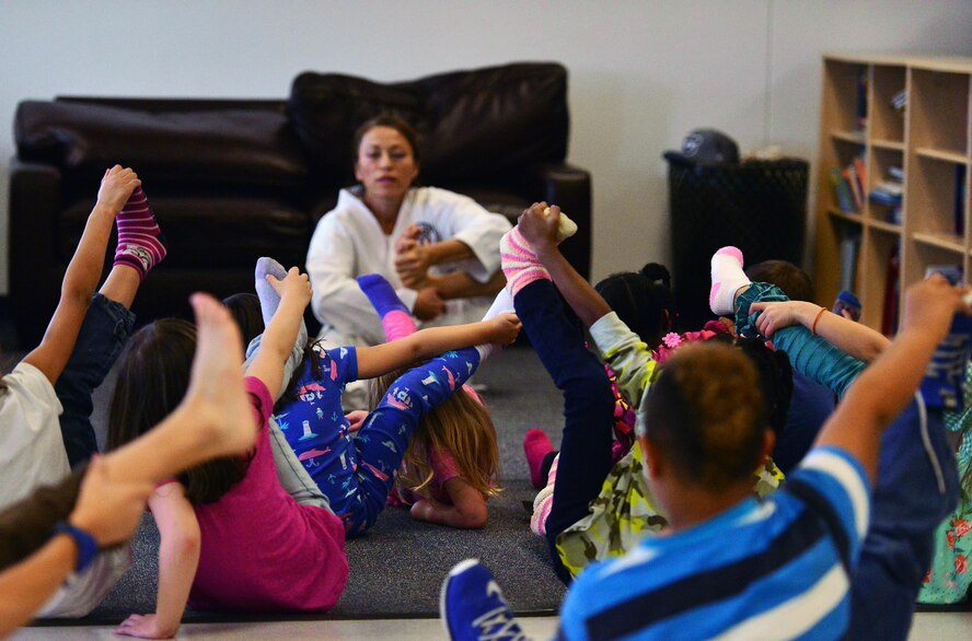 SCHRIEVER AIR FORCE BASE, Colo.--Irene Okuyama Andreassen, United States Karate Academy, leads a karate lesson for Schriever School Age Care program youth at Schriever Air Force Base, Colorado, Friday, Dec. 9, 2016. The lesson provided physical and cognitive development skills. (U.S. Air Force photo/Brian Hagberg)