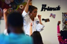 SCHRIEVER AIR FORCE BASE, Colo.--Irene Okuyama Andreassen, United States Karate Academy, leads a karate lesson for Schriever School Age Care program youth at Schriever Air Force Base, Colorado, Friday, Dec. 9, 2016. The lesson provided physical and cognitive development skills. (U.S. Air Force photo/Brian Hagberg)