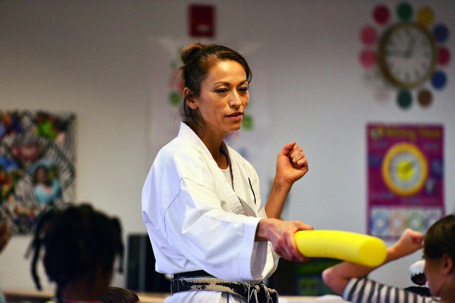 SCHRIEVER AIR FORCE BASE, Colo.--Irene Okuyama Andreassen, United States Karate Academy, leads a karate lesson for Schriever School Age Care program youth at Schriever Air Force Base, Colorado, Friday, Dec. 9, 2016. The lesson provided physical and cognitive development skills. (U.S. Air Force photo/Brian Hagberg)