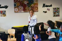 SCHRIEVER AIR FORCE BASE, Colo.--Irene Okuyama Andreassen, United States Karate Academy, leads a karate lesson for Schriever School Age Care program youth at Schriever Air Force Base, Colorado, Friday, Dec. 9, 2016. The lesson provided physical and cognitive development skills. (U.S. Air Force photo/Brian Hagberg)