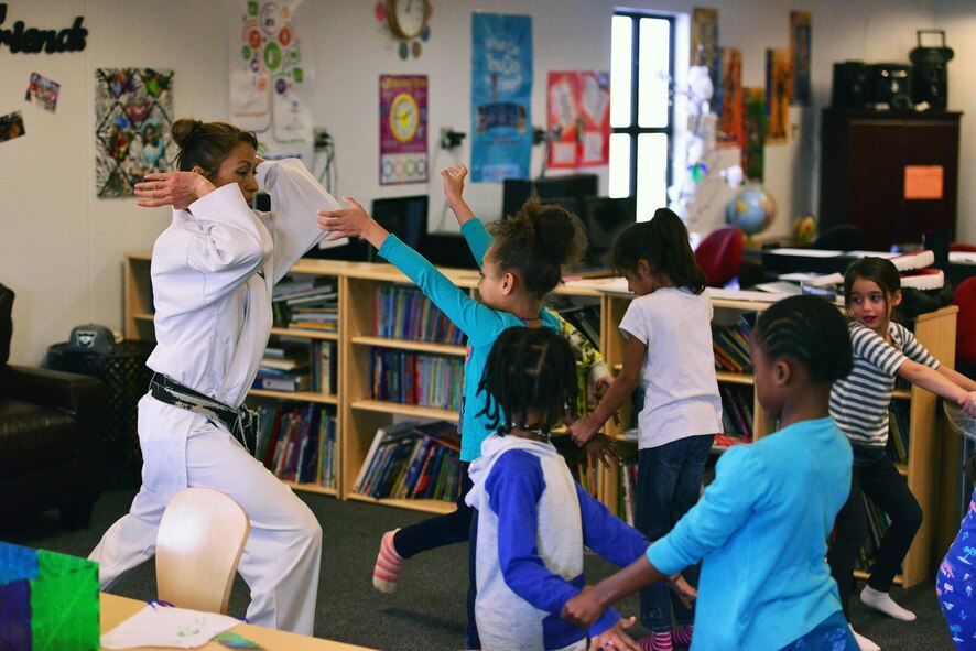SCHRIEVER AIR FORCE BASE, Colo.--Irene Okuyama Andreassen, United States Karate Academy, leads a karate lesson for Schriever School Age Care program youth at Schriever Air Force Base, Colorado, Friday, Dec. 9, 2016. The lesson provided physical and cognitive development skills. (U.S. Air Force photo/Brian Hagberg)