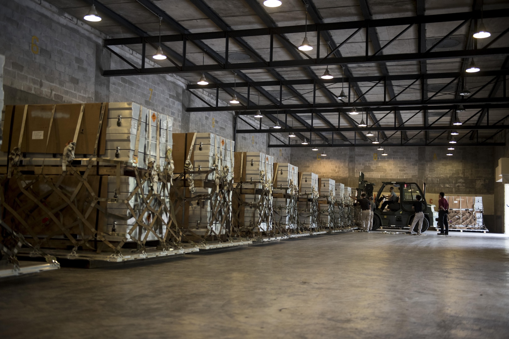 Orders of munitions line the walls of a warehouse during a Tactical Ammunition Rapid Response Package exercise Dec. 6, 2016, at Kadena Air Base, Japan. Kadena Air Base is one of only two bases in the entire U.S. Air Force to have the TARRP mission. (U.S. Air Force photo by Senior Airman Omari Bernard/Released)