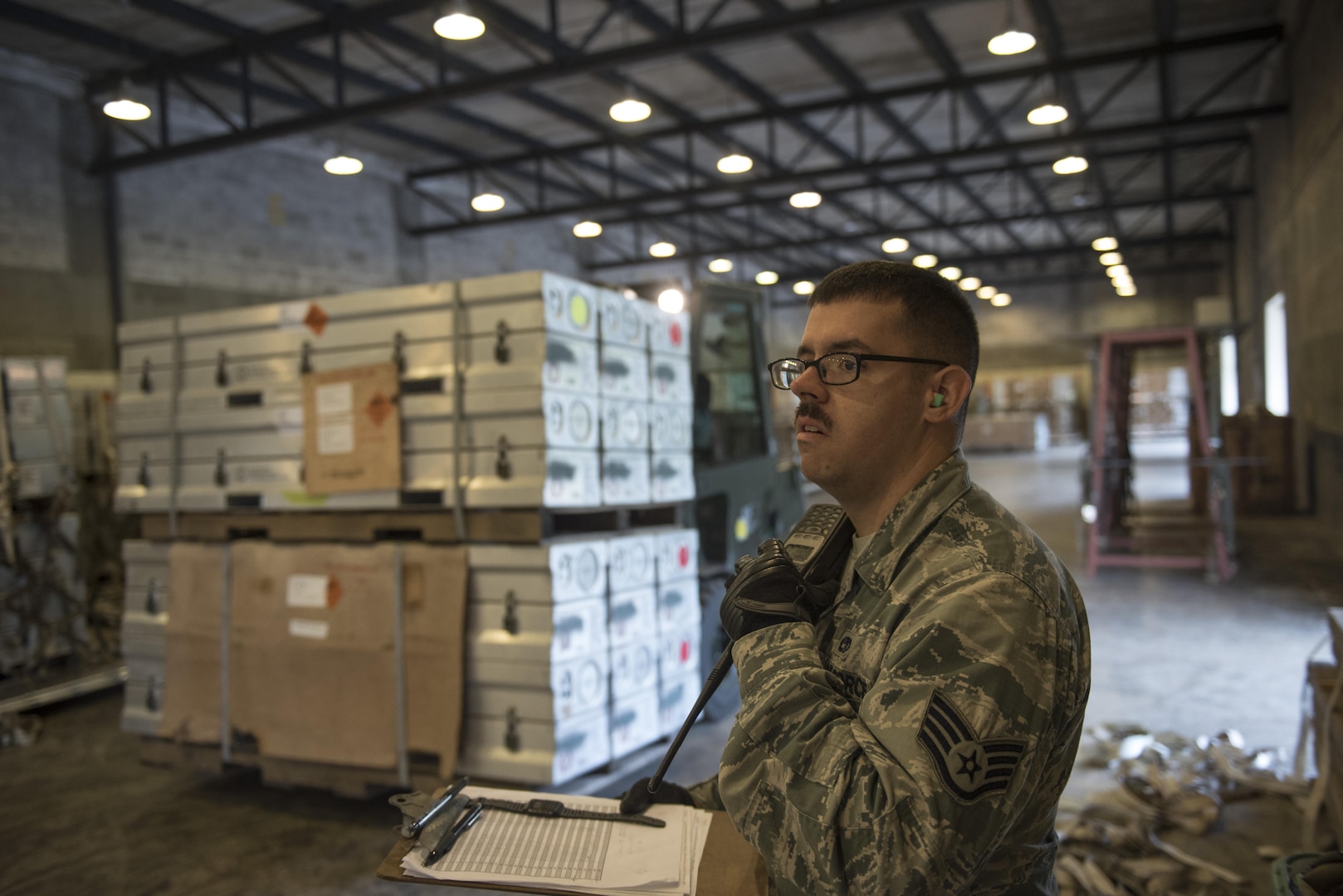 U.S. Air Force Staff Sgt. Beau Bridges reports the build time of a munitions package during a Tactical Ammunition Rapid Response Package exercise Dec. 6, 2016, at Kadena Air Base, Japan. During the TARRP exercise, munitions Airmen are timed and inspected during package builds for proficiency and safety. (U.S. Air Force photo by Senior Airman Omari Bernard/Released)