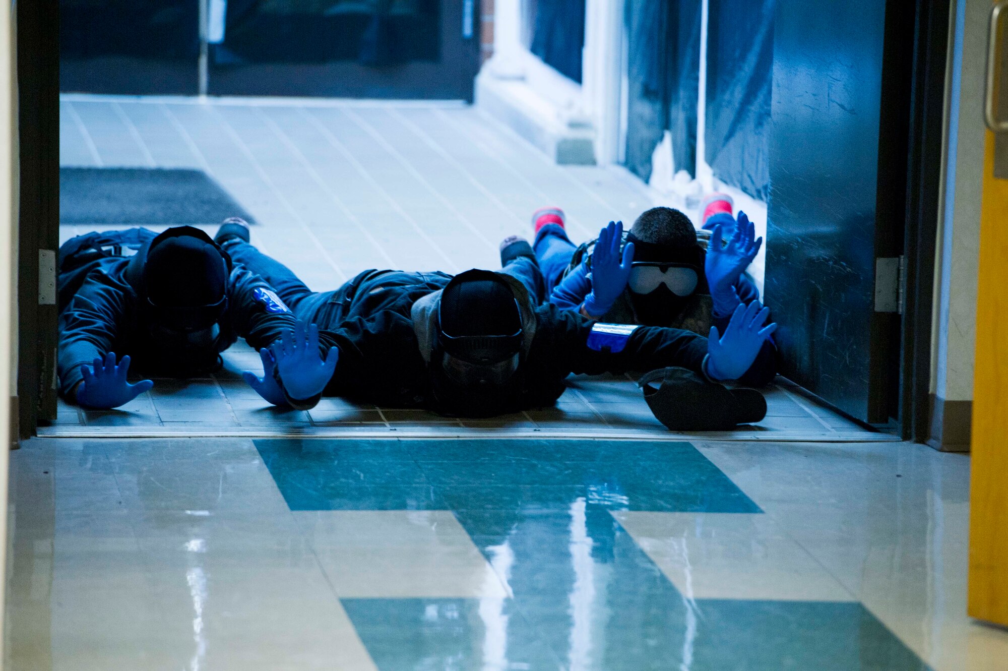 Recruits from the 446th Development and Training Flight are instructed to go prone during an Active Shooter exercise at Joint Base Lewis-McChord, Dec. 3. Among the most vital purposes of the exercise was to validate the efficacy of the Shoot Move Communicate training to include the use of reasonable force. During the exercise Quick Response Forces reacted and had to make split-second decisions about the level of force that was necessary to engage in. (U.S. Air Force Reserve photo by Staff Sgt. Daniel Liddicoet)