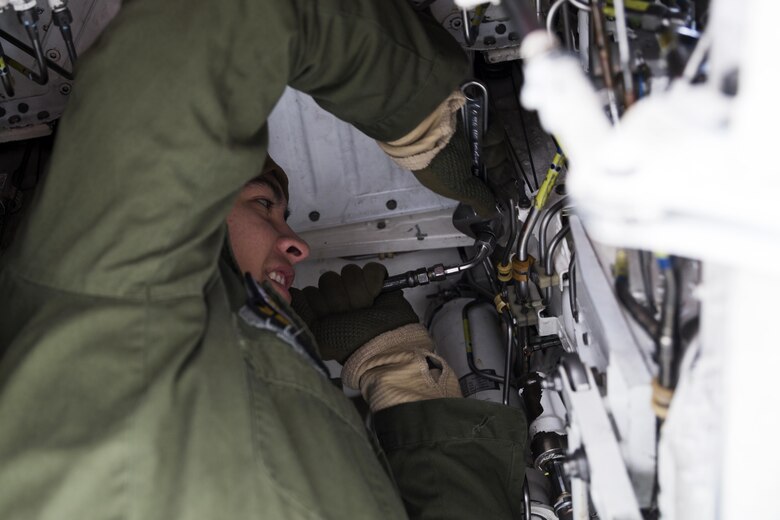 U.S. Marine Corps Lance Cpl. Anthony Dominguez, an air framer with Marine Attack Squadron (VMA) 542, works on an AV-8B Harrier during the Aviation Training Relocation Program at Chitose Air Base, Japan, Dec. 7, 2016. Keeping the Harriers well maintained and ensuring the proper function of all systems is essential to supporting the ATR. (U.S. Marine Corps photo by Lance Cpl. Joseph Abrego)