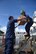 U.S. Coast Guard Senior Chief Petty Officer Mark Petty and Petty Officer 3rd Class Hannah Blanco boatswains’s mates aboard the U.S. Coast Guard Cutter Sequoia, load packages onto the ship for Operation Christmas Drop Nov. 22, 2016, at Apra Harbor, Naval Base Guam. The crew of the Sequoia participated in Operation Christmas Drop 2016 by delivering tools, toys, food and water to islands throughout the Pacific. (U.S. Air Force photo by Airman 1st Class Jacob Skovo)