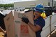U.S. Coast Guard Petty Officer 3rd Class Jonathan Gonzales, a boatswains’s mate aboard the U.S. Coast Guard Cutter Sequoia, carries a box of gifts for Operation Christmas Drop Nov. 22, 2016, at Apra Harbor, Naval Base Guam. During Operation Christmas Drop 2016, the U.S. Air Force, U.S. Coast Guard, U.S. Navy and international partners from the Japan Air Self-Defense Force and Royal Australian Air Force worked together to deliver goods to islands throughout the Pacific. (U.S. Air Force photo by Airman 1st Class Jacob Skovo)