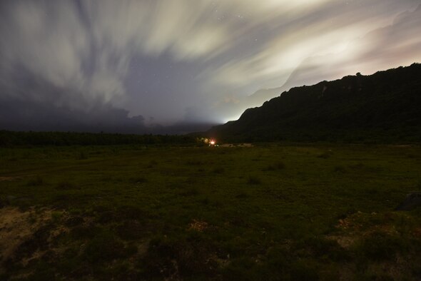 A blast shines as U.S. Army Soldiers from Alpha Company, 4th Battalion, 23rd Infantry Regiment, 2nd Stryker Brigade Combat Team, 2nd Infantry Division, destroy a bunker with a simulated grenade during a squad live-fire exercise Nov. 18, 2016 at Andersen Air Force Base, Guam. After executing their objective during daylight hours, squads repeated the scenario using infrared lasers to mark their targets in the dark to gain experience working in low-light situations. (U.S. Air Force photo by Airman 1st Class Jacob Skovo)