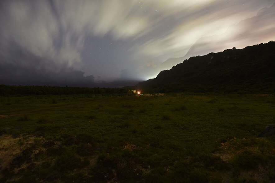 A blast shines as U.S. Army Soldiers from Alpha Company, 4th Battalion, 23rd Infantry Regiment, 2nd Stryker Brigade Combat Team, 2nd Infantry Division, destroy a bunker with a simulated grenade during a squad live-fire exercise Nov. 18, 2016 at Andersen Air Force Base, Guam. After executing their objective during daylight hours, squads repeated the scenario using infrared lasers to mark their targets in the dark to gain experience working in low-light situations. (U.S. Air Force photo by Airman 1st Class Jacob Skovo)