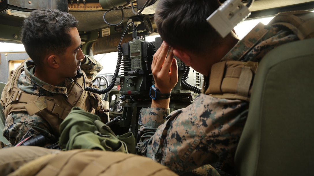 Sgt. Aidan Cool (right), and an infantry assaultman and Cpl. Osvaldo Mozqueda (left), a combat engineer, conduct routine radio operations during the Marine Corps Combat Readiness Evaluation on December 8, 2016 on Ie Shima Island in Okinawa, Japan. The Marines are attached to 3rd Marine Logistics Group, III Marine Expeditionary Force and during the operation practiced patrolling fundamentals, hand and arm signals, formations and immediate responses to an imminent threat. Cool is a native of Wadsworth, Ohio and Mozqueda is a native of San Jacinto, California,   (U.S. Marine Corps photo by Lance Cpl. Andrew Neumann/Released)