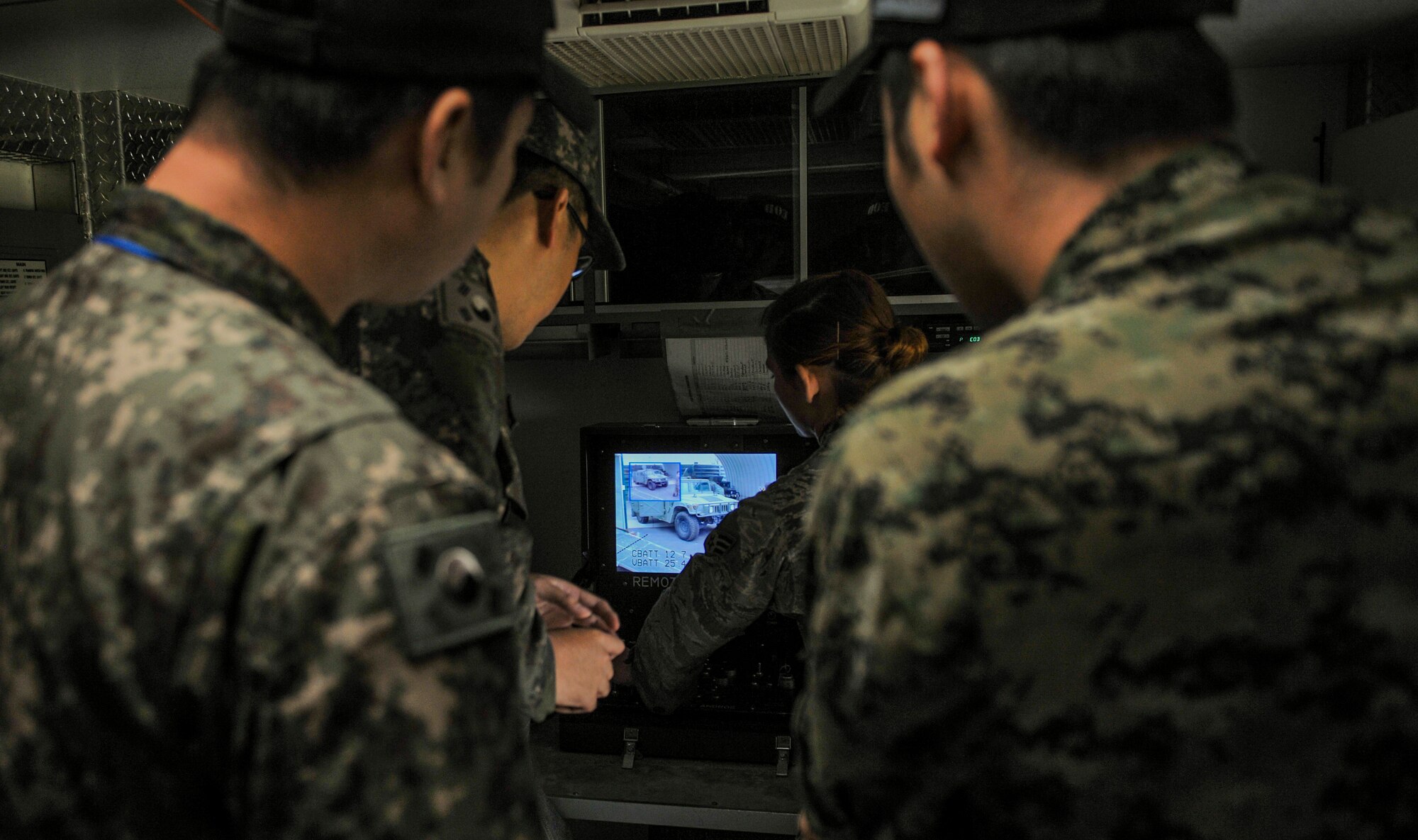 U.S. Air Force Senior Airman Kristen Fay, 8th Civil Engineer Squadron explosive ordnance disposal technician, shows Republic of Korea Air Force EOD team how the remote controls for the Andros F-6 robot work at Kunsan Air Base, Republic of Korea, Nov. 7, 2016. This training increases U.S. and ROK interoperability and ultimately enhances U.S. and ROK commitments to maintain peace in the region. (U.S. Air Force photo by Senior Airman Colville McFee/Released)
